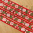 Kép 1/2 - Hímzett szalag – Matyó mintával, piros alapon fehér virággal, 2,3cm